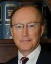 John E. Suthers