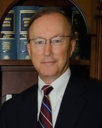 John E. Suthers