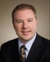 Travis L. DeLucenay