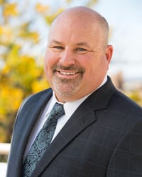 Mark E. Komer