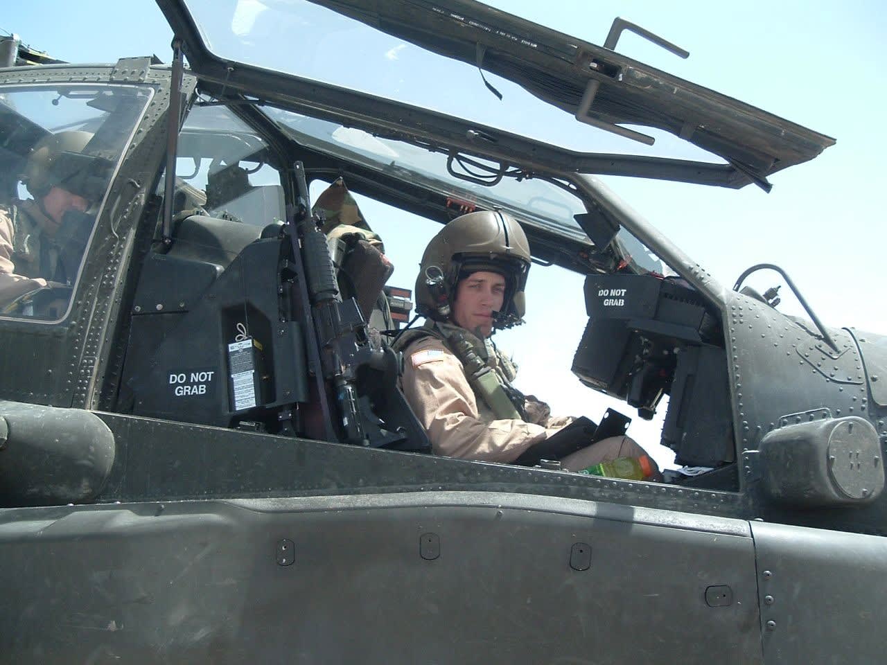 Clinton T. Speegle in an Apache helicopter in Iraq.